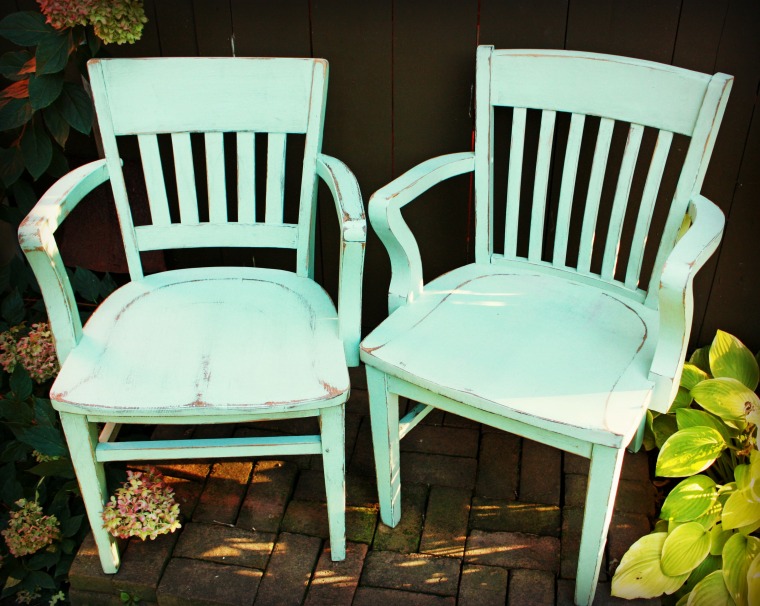 pair of aqua chairs.