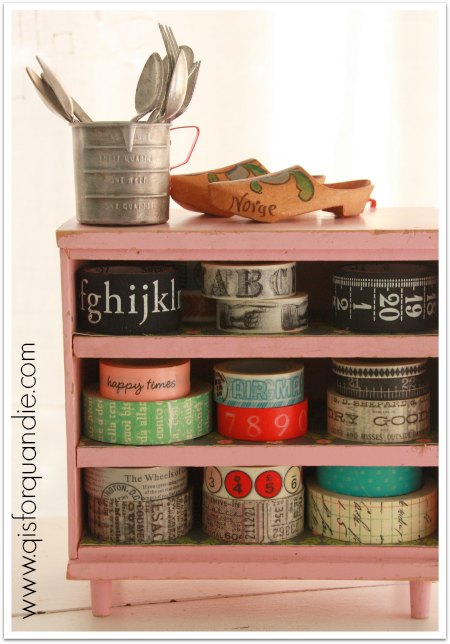 Washi tape stored in vintage pink toy dresser.